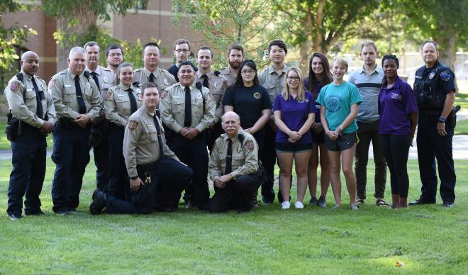 The staff of The College of Idaho Campus Safety pose outside.