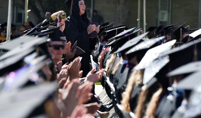College of Idaho students applaud at Commencement.
