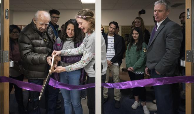Winston Moore (far left) cuts the ribbon to the Winston and Diane Moore Outdoor Program Center with the help of students on Nov. 13, 2018.
