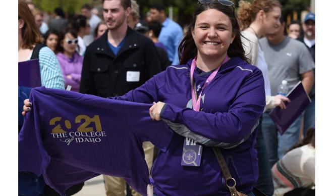 Student Holding Up T-Shirt