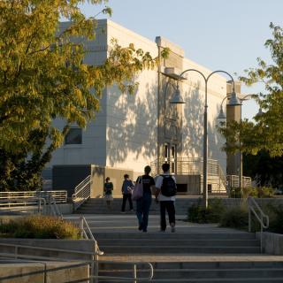 Students walk to campus building