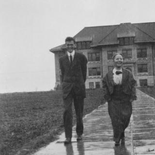 1900s photo of two people outside Sterry Hall