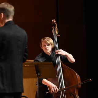 Stdent playing an upright bass