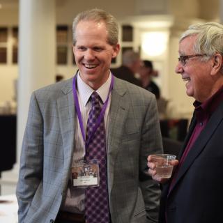 Bob Hoover and Jack Cafferty laughing at an event