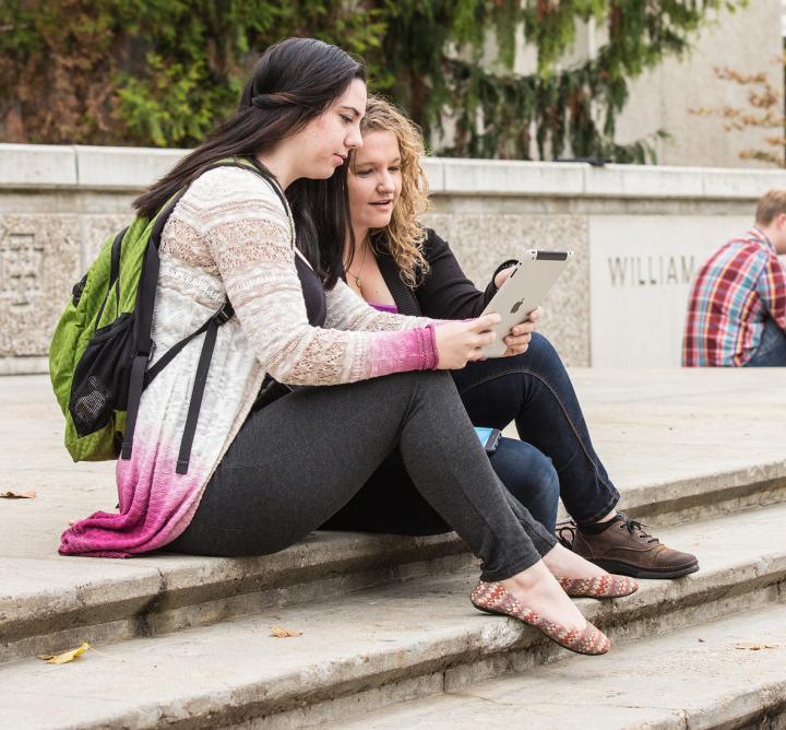 Students sitting on steps