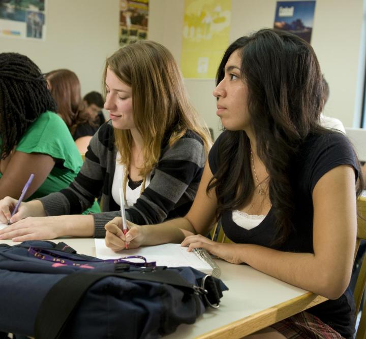 Students taking notes in class