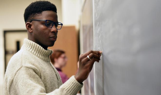 Student at chalkboard