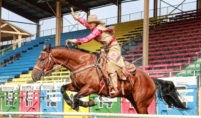 C of I senior Betsy West takes a jump on horseback during the 2017 Pendleton Round-Up