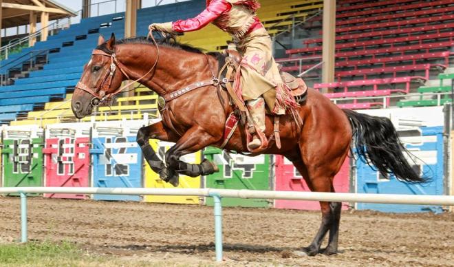 C of I senior Betsy West takes a jump on horseback during the 2017 Pendleton Round-Up