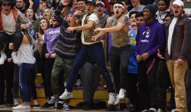 A crowd of students cheers on the Yotes during a home basketball game vs. Warner Pacific.