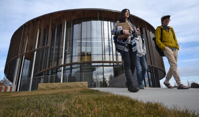 Students walk out of Cruzen-Murray Library on its opening day, Jan. 31, 2018.