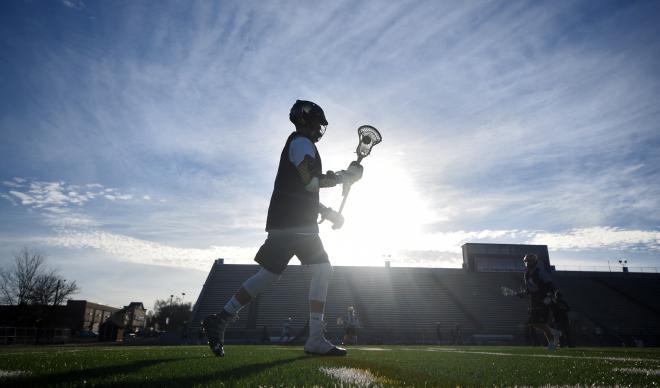 C of I's men's lacrosse team practices at Simplot Stadium.