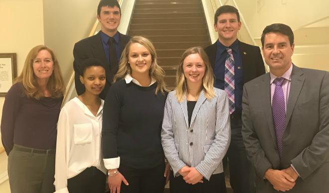 The C of I CFA Challenge team poses on the stairs of KAIC.