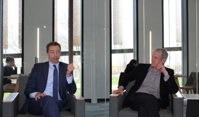 Doug Brigham and Jim Everett sit next to one another in the Cruzen-Murray Library.