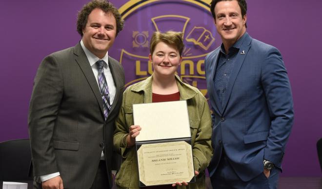 Melanie Miller (center) stands with Matt Gier (left) and Paul Bennion (right) after receiving the Student Affairs Integrity, Leadership and Service Award.