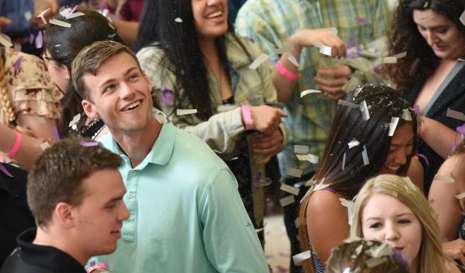 Senior students celebrate in falling confetti at the 2018 Senior Toast.