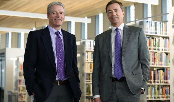 Jim Everett (left) and Doug Brigham (right) stand in the Cruzen-Murray Library.