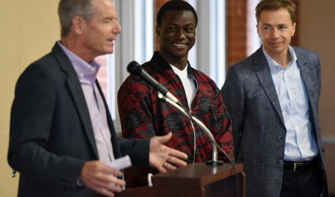 Jim Everett (left) delivers a speech at the 6th Annual Caldwell Youth Forum alongside C of I freshman Omotayo Akingba and C of I Co-President Doug Brigham.