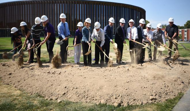 Fifteen shovels officially break ground for the Smith Welcoming Arches on Sept. 6, 2018.