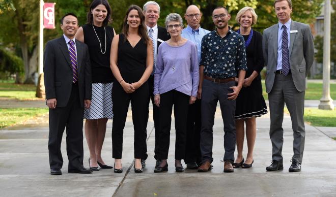 The 2018 Distinguished Alumni Award winners pose with campus leadership.