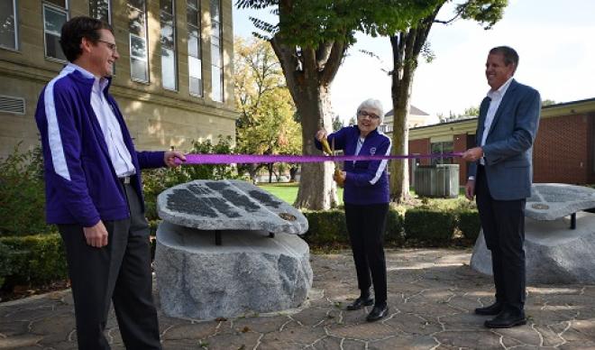 Mary Jensen Wagers '57 cuts the ribbon at the improved Wagers Memorial Garden.