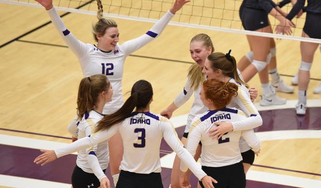 The C of I volleyball team embraces following a successful point against Evergreen in the CCC Championship Quarterfinals.