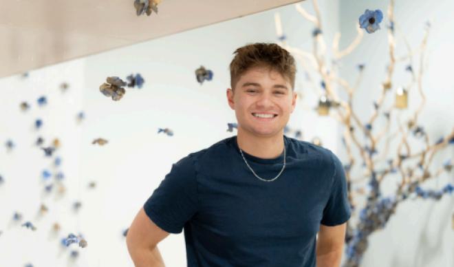 Jackson standing in front of art installation 