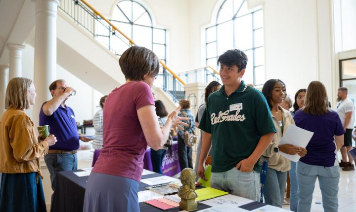 Student talking to staff