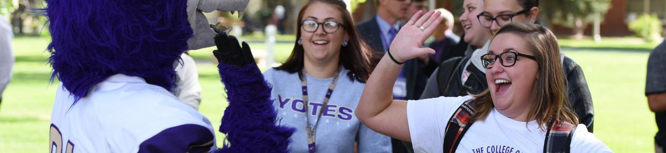 happy students with mascot